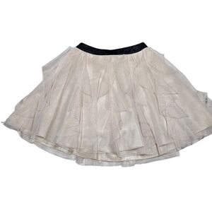 This is a NWOT size 1-2, dusty pink Tule and Rayon skirt. TeezeMe brand.